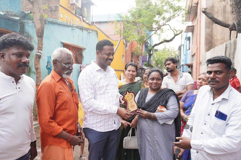 Distributing 5 kg rice bags to specially-abled res